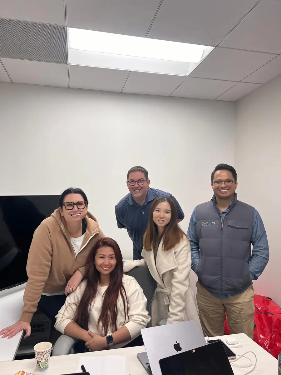 Joy with the RCVR team in the office