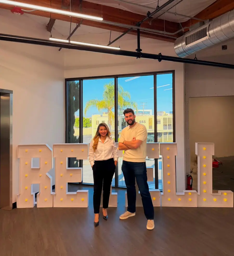 Joy with a colleague at the Retell AI office