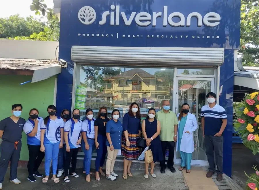 Clinic and pharmacy team outside their storefront